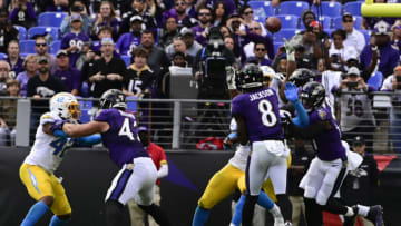 Oct 17, 2021; Baltimore, Maryland, USA; Baltimore Ravens quarterback Lamar Jackson (8) throws to tight end Mark Andrews (not pictured) for a touchdown during the second half against the Los Angeles Chargers at M&T Bank Stadium. Mandatory Credit: Tommy Gilligan-USA TODAY Sports