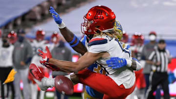 Nov 28, 2020; Pasadena, California, USA; Arizona Wildcats wide receiver Tayvian Cunningham (11) collides with UCLA Bruins defensive back Elisha Guidry (30) during a third quarter pass play at Rose Bowl. Guidry was call for a penalty on the play. Mandatory Credit: Robert Hanashiro-USA TODAY Sports