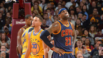 CLEVELAND, OH - JANUARY 18: LeBron James #23 of the Cleveland Cavaliers looks on against Stephen Curry #30 of the Golden State Warriors on January 18, 2016 at Quicken Loans Arena in Cleveland, Ohio. NOTE TO USER: User expressly acknowledges and agrees that, by downloading and/or using this Photograph, user is consenting to the terms and conditions of the Getty Images License Agreement. Mandatory Copyright Notice: Copyright 2016 NBAE (Photo by Jesse D. Garrabrant/NBAE via Getty Images)