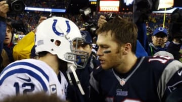 Jan 11, 2014; Foxborough, MA, USA; New England Patriots quarterback Tom Brady (12) and Indianapolis Colts quarterback Andrew Luck (12) meet the 2013 AFC divisional playoff football game at Gillette Stadium. The Patriots defeated the Indianapolis Colts 43-22. Mandatory Credit: David Butler II-USA TODAY Sports