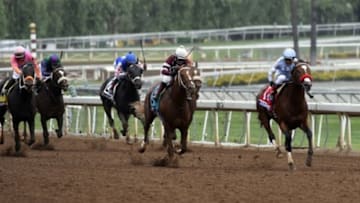 Oct 31, 2014; Santa Anita , CA, USA; Rafael Bejarano aboard Goldencents leads a group to the finish in race seven of the 2014 Breeders Cup Championships at Santa Anita Park. Mandatory Credit: Richard Mackson-USA TODAY Sports