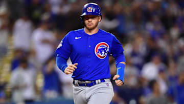 Chicago Cubs left fielder Ian Happ scores a run against the Los Angeles Dodgers. USA Today.
