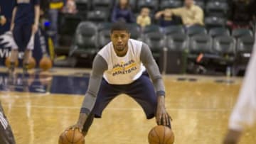 Jan 9, 2015; Indianapolis, IN, USA; Indiana Pacers forward Paul George (13) works on his dribbling during warmups before the game against the Boston Celtics at Bankers Life Fieldhouse. Mandatory Credit: Trevor Ruszkowski-USA TODAY Sports