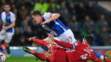 BLACKBURN, ENGLAND - MARCH 07:Blackburn Rovers' Charlie Mulgrew is tackled by Cardiff City's Sean Morrison during the Sky Bet Championship match between Blackburn Rovers and Cardiff City at Ewood Park on March 7, 2017 in Blackburn, England. (Photo by Dave Howarth - CameraSport via Getty Images)