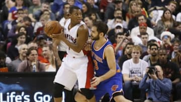 Dec 21, 2014; Toronto, Ontario, CAN; Toronto Raptors guard Kyle Lowry (7) dribbles the ball as New York Knicks guard Jose Calderon (3) defends at the Air Canada Centre. The Raptors won 118-108. Mandatory Credit: John E. Sokolowski-USA TODAY Sports