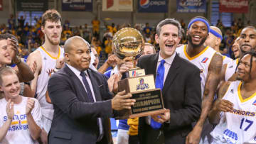 SANTA CRUZ, CA - APRIL 26: President Malcolm Turner hands Head Coach Casey Hill the Championship Trophy at the NBA D-League Finals game on April 26, 2015 at Kaiser Permanente Arena in Santa Cruz, California. NOTE TO USER: User expressly acknowledges and agrees that, by downloading and/or using this Photograph, user is consenting to the terms and conditions of the Getty Images License Agreement. Mandatory Copyright Notice: Copyright 2015 NBAE (Photo by Tim Cattera/NBAE via Getty Images)