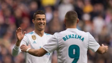 MADRID, SPAIN - NOVEMBER 25: Karim Benzema of Real Madrid CF celebrates with Cristiano Ronaldo after scoring his team's opening goal during the La Liga match between Real Madrid and Malaga at Estadio Santiago Bernabeu on November 25, 2017 in Madrid, Spain. (Photo by Denis Doyle/Getty Images)