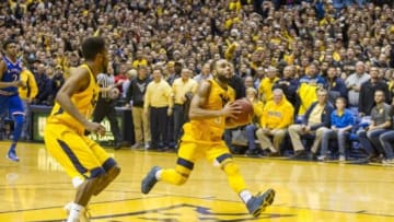 Jan 12, 2016; Morgantown, WV, USA; West Virginia Mountaineers guard Jaysean Paige (5) jumps to dunk at the end of regulation to beat the Kansas Jayhawks at the WVU Coliseum. Mandatory Credit: Ben Queen-USA TODAY Sports