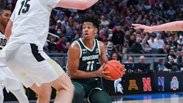 INDIANAPOLIS, INDIANA - MARCH 12: A.J. Hoggard #11 of the Michigan State Spartans looks to make a play against Purdue Boilermaker defenders during the first half of a Men's Big Ten Tournament Semifinals game at Gainbridge Fieldhouse on March 12, 2022 in Indianapolis, Indiana. (Photo by Aaron J. Thornton/Getty Images)