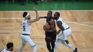 Miami Heat center Bam Adebayo (13) looks to move the ball defended by Boston Celtics guard Derrick White (9) and guard Jaylen Brown (7) (Bob DeChiara-USA TODAY Sports)