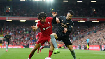 LIVERPOOL, ENGLAND - APRIL 09: Trent Alexander-Arnold of Liverpool challenges Gabriel Martinelli of Arsenal during the Premier League match between Liverpool FC and Arsenal FC at Anfield on April 09, 2023 in Liverpool, England. (Photo by Shaun Botterill/Getty Images)