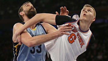 Feb 5, 2016; New York, NY, USA; New York Knicks forward Kristaps Porzingis (6) and Memphis Grizzlies center Marc Gasol (33) battle for a rebound during the first half at Madison Square Garden. Mandatory Credit: Adam Hunger-USA TODAY Sports
