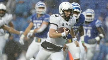 UCF quarterback McKenzie Milton scrambles in for a touchdown against Memphis in the Knights' 31-30 win at the Liberty Bowl in Memphis, Tenn., Saturday, October 13, 2018.Jron9884