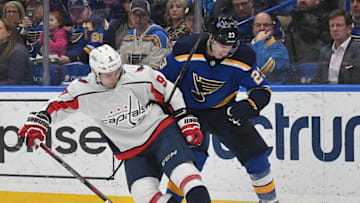 ST. LOUIS, MO - April 02: Washington Capitals defenseman Dimitry Orlov (9) and St. Louis Blues right wing Dmitrij Jaskin (23) compete for the puck during a NHL game between the Washington Capitals and the St. Louis Blues on April 02, 2018, at Scottrade Certer, St. Louis, MO. (Photo by Keith Gillett/Icon Sportswire via Getty Images).