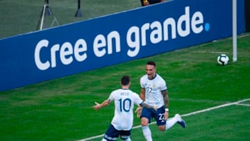 Argentina's Lautaro Martinez (R) celebrates with teammate Lionel Messi after scoring against Venezuela during their Copa America football tournament quarter-final match at Maracana Stadium in Rio de Janeiro, Brazil, on June 28, 2019. (Photo by Mauro PIMENTEL / AFP) (Photo credit should read MAURO PIMENTEL/AFP via Getty Images)