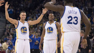 December 20, 2016; Oakland, CA, USA; Golden State Warriors guard Stephen Curry (30) and forward Andre Iguodala (9) congratulate forward Draymond Green (23) for scoring a basket during the second quarter against the Utah Jazz at Oracle Arena. Mandatory Credit: Kyle Terada-USA TODAY Sports