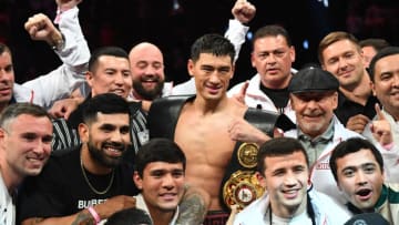 Russian boxer Dmitry Bivol (C) celebrates after defeating Mexican boxer Canelo Alvarez during their light-heavyweight world title boxing match at T-Mobile Arena in Las Vegas, Nevada, May 7, 2022. (Photo by Patrick T. FALLON / AFP) (Photo by PATRICK T. FALLON/AFP via Getty Images)