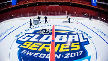 STOCKHOLM, SWEDEN - NOVEMBER 02: Members of the ice crew install logos and lines on the ice during the rink build out ahead of the SAP NHL Global Series between Ottawa Senators and Colorado Avalanche at Ericsson Globe on November 2, 2017 in Stockholm, Sweden. (Photo by Pontus Orre/NHLI via Getty Images)