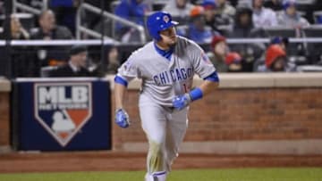 Oct 17, 2015; New York City, NY, USA; Chicago Cubs left fielder Kyle Schwarber hits a solo home run against the New York Mets in the 8th inning in game one of the NLCS at Citi Field. Mandatory Credit: Robert Deutsch-USA TODAY Sports