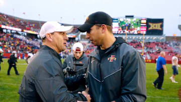 AMES, IA - OCTOBER 14: Head coach David Beaty of the Kansas Jayhawks , left, shakes hands with head coach Matt Campbell of the Iowa State Cyclones at mid field after his team lost 45-0 to the Iowa State Cyclones iat Jack Trice Stadium on October 14, 2017 in Ames, Iowa. The Iowa State Cyclones won 45-0 over the Kansas Jayhawks. (Photo by David Purdy/Getty Images)