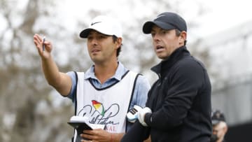 Mar 6, 2021; Orlando, Florida, USA; Rory McIlroy talks with his caddie Harry Diamond (left) on the 15th tee box during the third round of the Arnold Palmer Invitational golf tournament at Bay Hill Club & Lodge. Mandatory Credit: Reinhold Matay-USA TODAY Sports