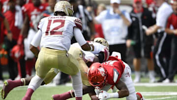 Sep 17, 2016; Louisville, KY, USA; Louisville Cardinals cornerback Jaire Alexander (10) recovers a fumble from Florida State Seminoles running back Dalvin Cook (4) during the second quarter at Papa John
