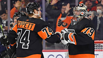 Oct 27, 2022; Philadelphia, Pennsylvania, USA; Philadelphia Flyers right wing Owen Tippett (74) and goaltender Carter Hart (79) celebrate win against the Florida Panthers at Wells Fargo Center. Mandatory Credit: Eric Hartline-USA TODAY Sports