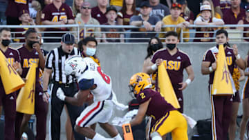 TEMPE, ARIZONA - NOVEMBER 27: Running back Michael Wiley #6 of the Arizona Wildcats scores on a five-yard touchdown reception past wide receiver Geordon Porter #2 of the Arizona State Sun Devils during the third quarter of the Territorial Cup game at Sun Devil Stadium on November 27, 2021 in Tempe, Arizona. (Photo by Christian Petersen/Getty Images)