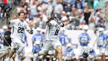 FOXBORO, MA - MAY 28: William Renz #16 of the Yale Bulldogs and Ryan McQuaide #22 celebrate after defeating the Duke Blue Devils 13-11 in the 2018 NCAA Division I Men's Lacrosse Championship game at Gillette Stadium on May 28, 2018 in Boston, Massachusetts. (Photo by Maddie Meyer/Getty Images)