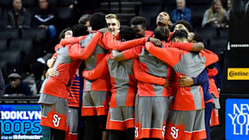 The St. John's basketball team huddles inside the Barclays Center prior to a game. (Photo by Steven Ryan/Getty Images)