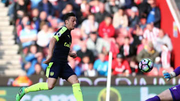 STOKE ON TRENT, ENGLAND - MAY 13: Mesut Ozil of Arsenal scores a goal to make it 0-2 during the Premier League match between Stoke City and Arsenal at Bet365 Stadium on May 13, 2017 in Stoke on Trent, England. (Photo by James Baylis - AMA/Getty Images)