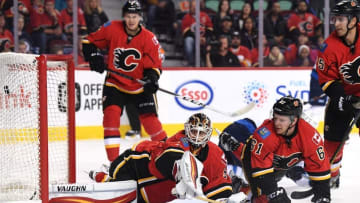 Oct 2, 2016; Calgary, Alberta, CAN; Calgary Flames goalie Chad Johnson (31) watches the puck go past against the Winnipeg Jets during the first period at Scotiabank Saddledome. Mandatory Credit: Candice Ward-USA TODAY Sports