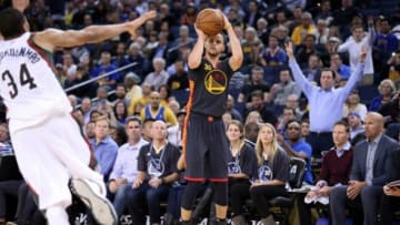 Mar 4, 2015; Oakland, CA, USA; Golden State Warriors guard Stephen Curry (30) shoots a three point basket against the Milwaukee Bucks during the fourth quarter at Oracle Arena. The Golden State Warriors defeated the Milwaukee Bucks 102-93. Mandatory Credit: Kelley L Cox-USA TODAY Sports