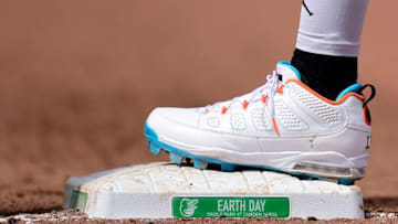BALTIMORE, MD - APRIL 22: A detail view of Manny Machado #13 of the Baltimore Orioles baseball cleats as he stands on first base in the sixth inning against the Cleveland Indians on Earth Day at Oriole Park at Camden Yards on April 22, 2018 in Baltimore, Maryland. (Photo by Patrick McDermott/Getty Images)
