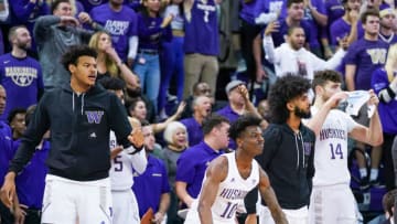 SEATTLE, WA - DECEMBER 08: Elijah Hardy #10 and Sam Timmins #14 of the Washington Huskies celebrate with teammates and fans as the Huskies attempt a comeback in the 2nd half against the Gonzaga Bulldogs at Hec Edmundson Pavilion on December 8, 2019 in Seattle, Washington. (Photo by Mike Tedesco/Getty Images)