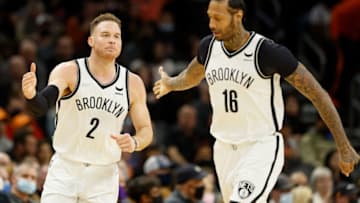 PHOENIX, ARIZONA - FEBRUARY 01: Blake Griffin #2 of the Brooklyn Nets high fives James Johnson #16 during the second half of the NBA game at Footprint Center on February 01, 2022 in Phoenix, Arizona. The Suns defeated the Nets 121-111. NOTE TO USER: User expressly acknowledges and agrees that, by downloading and or using this photograph, User is consenting to the terms and conditions of the Getty Images License Agreement. (Photo by Christian Petersen/Getty Images)