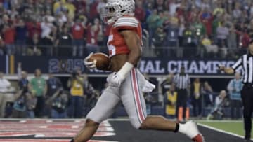 Jan 12, 2015; Arlington, TX, USA; Ohio State Buckeyes running back Ezekiel Elliott (15) scores a touchdown during the first quarter against the Oregon Ducks in the 2015 CFP National Championship Game at AT&T Stadium. Mandatory Credit: Kirby Lee-USA TODAY Sports