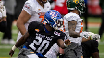 Feb 1, 2022; Mobile, AL, USA; National linebacker Kyron Johnson of Kansas (20) pursues a play during National practice for the 2022 Senior Bowl at Hancock Whitney Stadium. Mandatory Credit: Vasha Hunt-USA TODAY Sports