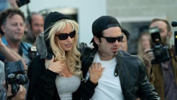 Pam & Tommy -- “I Love You, Tommy" - Episode 102 -- Pamela Anderson and Tommy Lee meet, get high and get married… all in four days. Pam (Lily James) and Tommy (Sebastian Stan), shown. (Photo by: Erin Simkin/Hulu)
