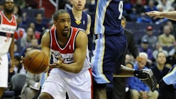 Mar 3, 2014; Washington, DC, USA; Washington Wizards point guard Andre Miller (24) looks to pass as Memphis Grizzlies shooting guard Tony Allen (9) defends during the first half at Verizon Center. Mandatory Credit: Brad Mills-USA TODAY Sports