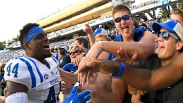 CHAPEL HILL, NC - SEPTEMBER 23: Joe Giles-Harris #44 of the Duke Blue Devils celebrates with fans after a win against the North Carolina Tar Heels at Kenan Stadium on September 23, 2017 in Chapel Hill, North Carolina. Duke won 27-17. (Photo by Grant Halverson/Getty Images)