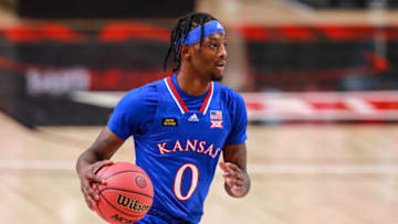LUBBOCK, TEXAS - DECEMBER 17: Guard Marcus Garrett #0 of the Kansas Jayhawks handles the ball during the first half of the college basketball game against the Texas Tech Red Raiders at United Supermarkets Arena on December 17, 2020 in Lubbock, Texas. (Photo by John E. Moore III/Getty Images)