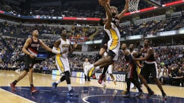 Dec 13, 2014; Indianapolis, IN, USA; Indiana Pacers forward Solomon Hill (44) takes a shot against Portland Trail Blazers center Robin Lopez (42) at Bankers Life Fieldhouse. Portland defeats Indiana 95-85. Mandatory Credit: Brian Spurlock-USA TODAY Sports