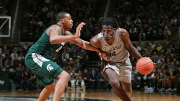 EAST LANSING, MI - DECEMBER 21: Xavier Hill-Mais #14 of the Oakland Golden Grizzlies drives to the basket while defended by Nick Ward #44 of the Michigan State Spartans in the second half at Breslin Center on December 21, 2018 in East Lansing, Michigan. (Photo by Rey Del Rio/Getty Images)