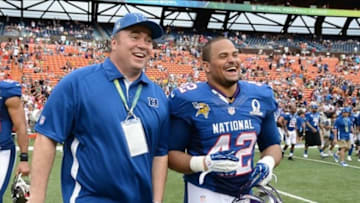 January 27, 2013; Honolulu, HI, USA; NFC head coach Mike McCarthy (left) celebrates with NFC fullback Jerome Felton of the Minnesota Vikings (42) after the 2013 Pro Bowl against the AFC at Aloha Stadium. The NFC defeated the AFC 62-35. Mandatory Credit: Kyle Terada-USA TODAY Sports