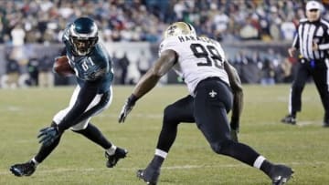 Jan 4, 2014; Philadelphia, PA, USA; Philadelphia Eagles wide receiver Jason Avant (81) runs with the ball as New Orleans Saints outside linebacker Parys Haralson (98) chases in the second quarter during the 2013 NFC wild card playoff football game at Lincoln Financial Field. Mandatory Credit: Geoff Burke-USA TODAY Sports