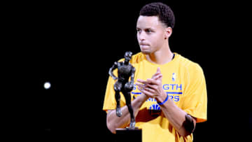 OAKLAND, CA - MAY 05: Stephen Curry #30 of the Golden State Warriors is presented with the 2014-2015 Kia NBA Most Valuable Player Trophy prior to the start of Game Two of the Western Conference Semifinals of the NBA Playoffs against the Memphis Grizzlies at ORACLE Arena on May 5, 2015 in Oakland, California. NOTE TO USER: User expressly acknowledges and agrees that, by downloading and or using this photograph, User is consenting to the terms and conditions of the Getty Images License Agreement. (Photo by Thearon W. Henderson/Getty Images)