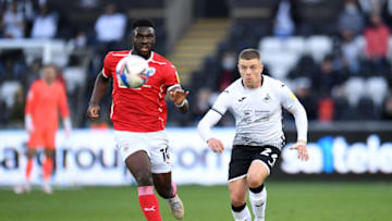 SWANSEA, WALES - MAY 22: Daryl Dike of Barnsley vies for possession with Jake Bidwell of Swansea City during the Sky Bet Championship Play-off Semi Final 2nd Leg match between Swansea City and Barnsley at the Liberty Stadium on May 22, 2021 in Swansea, Wales. (Photo by Athena Pictures/Getty Images)
