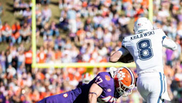 Clemson Tigers linebacker James Skalski (47) attempts to tackle Connecticut Huskies quarterback Steven Krajewski (8)at Memorial Stadium Saturday, Nov. 13, 2021.Jg Clemsonvsconnecticut 111321 040