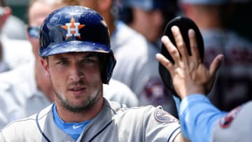 Houston Astros' Alex Bregman is greeted after scoring on a single by Carlos Correa in the first inning against the Kansas City Royals on Sunday, June 17, 2018, at Kauffman Stadium in Kansas City, Mo. (John Sleezer/Kansas City Star/TNS via Getty Images)